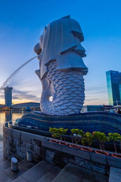 SINGAPORE CITY SINGAPORE: FEBRUARY 15 2020: Singapore Merlion Park downtown Singapore  business district at sunrise